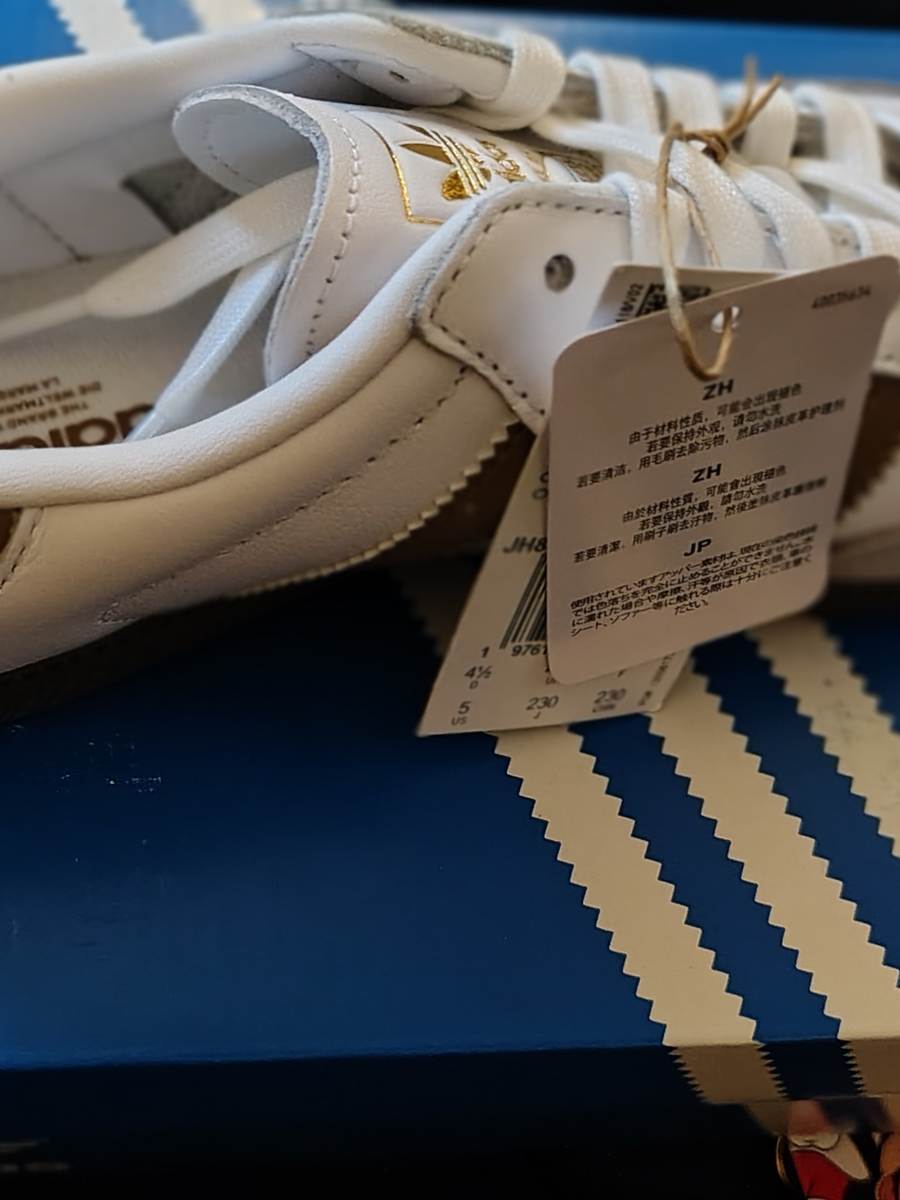 Adidas Men’s White Leather Sneakers with Gold Logo